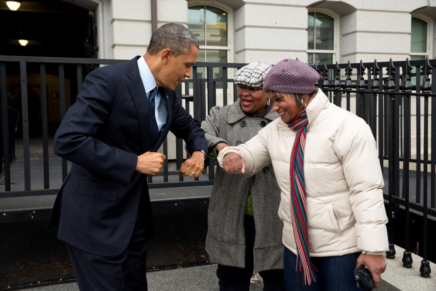 Barack Obama bumps elbows with women in the street