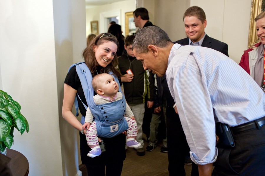 Barack Obama greets a tour group in the West Wing hallway, 2011