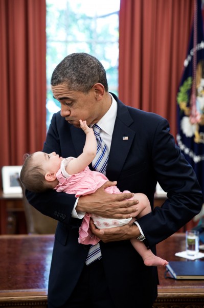Barack Obama holds six-month-old Talia Neufeld, 2013