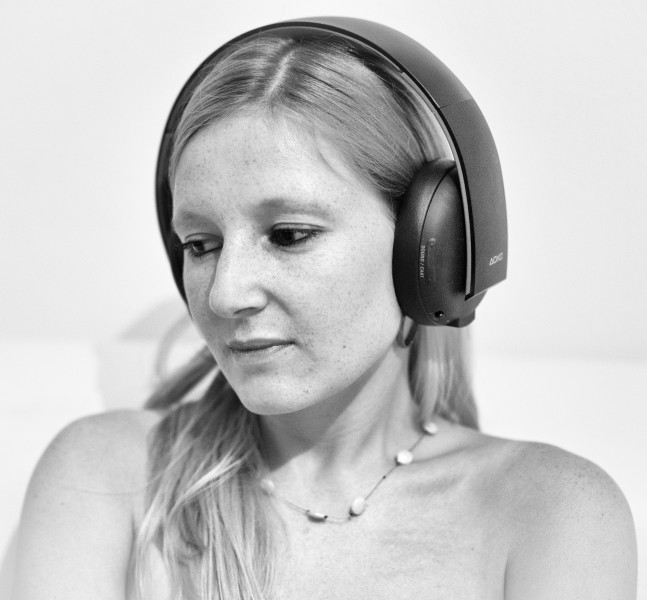 Beautiful girl listening to music with headphones