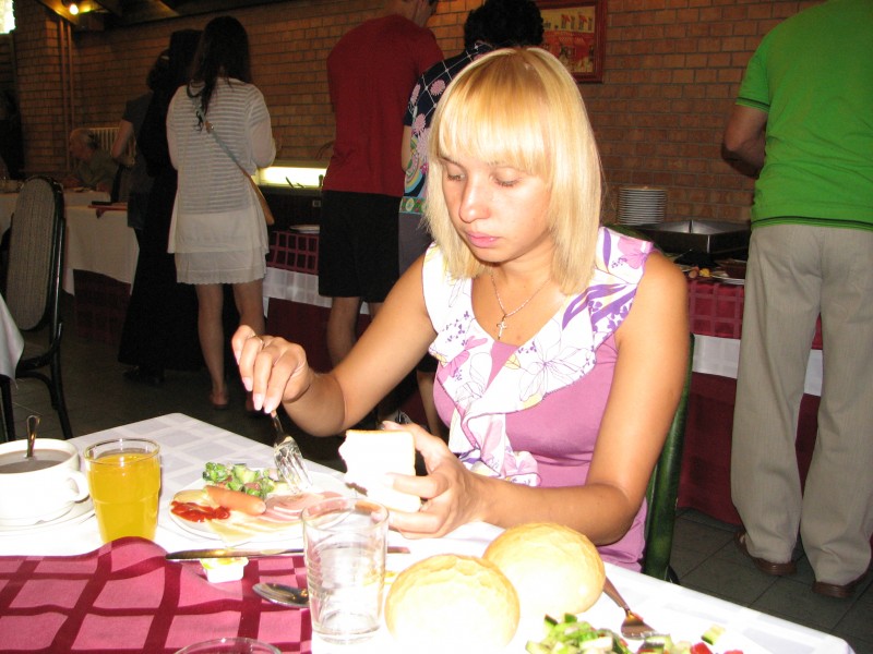 A young woman having meal in Budapest, Hungary, European Union, summer 2011, picture 1