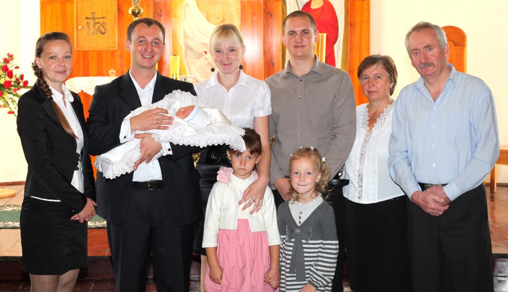 godparents and relatives after the baptism of a baby boy in the Catholic Church, photo 15