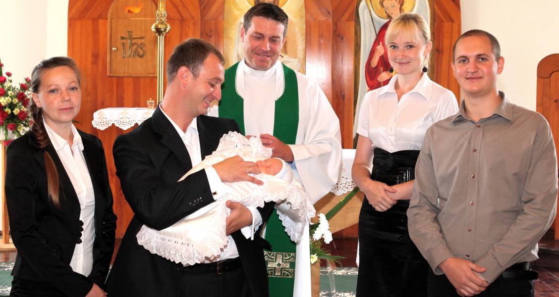 godparents, parents and the padre after the baptism of a baby boy in the Catholic Church, photo 19