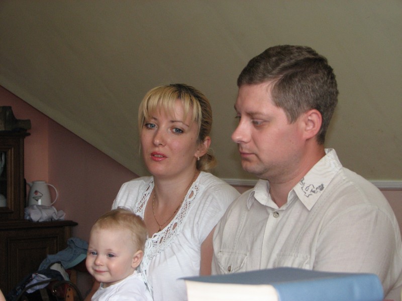 A young family at a meeting of Catholic married couples