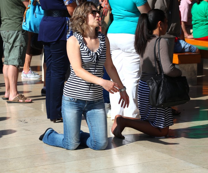 a woman walking on her knees in Fatima, Portugal, Europe, August 2013, picture 11