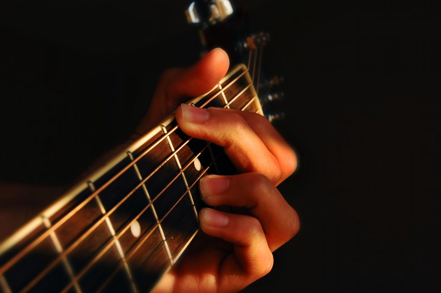 Fingers playing guitar