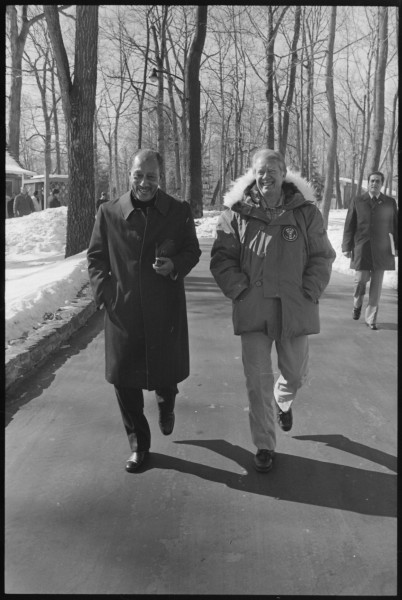 Jimmy Carter and Anwar Sadat walk along Camp David - NARA - 177884