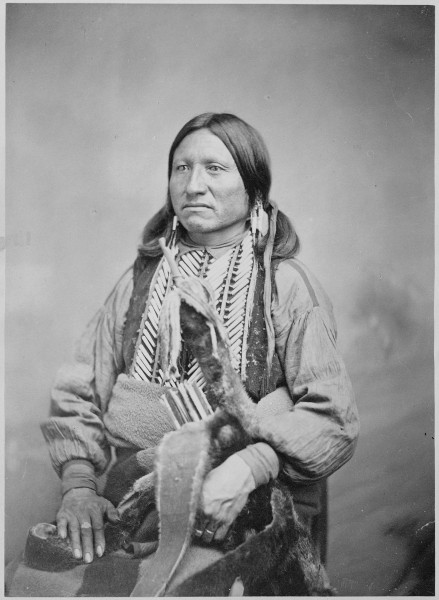 Kicking Bird (Tene'-angpote), a Kiowa chief and grandson of a Crow captive, three-quarter-length, seated, 1868 - 1874 - NARA - 518902