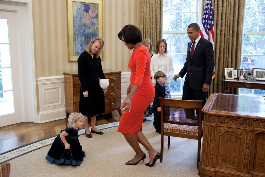 Michelle Obama curtsies with Lynne Silosky, 2010