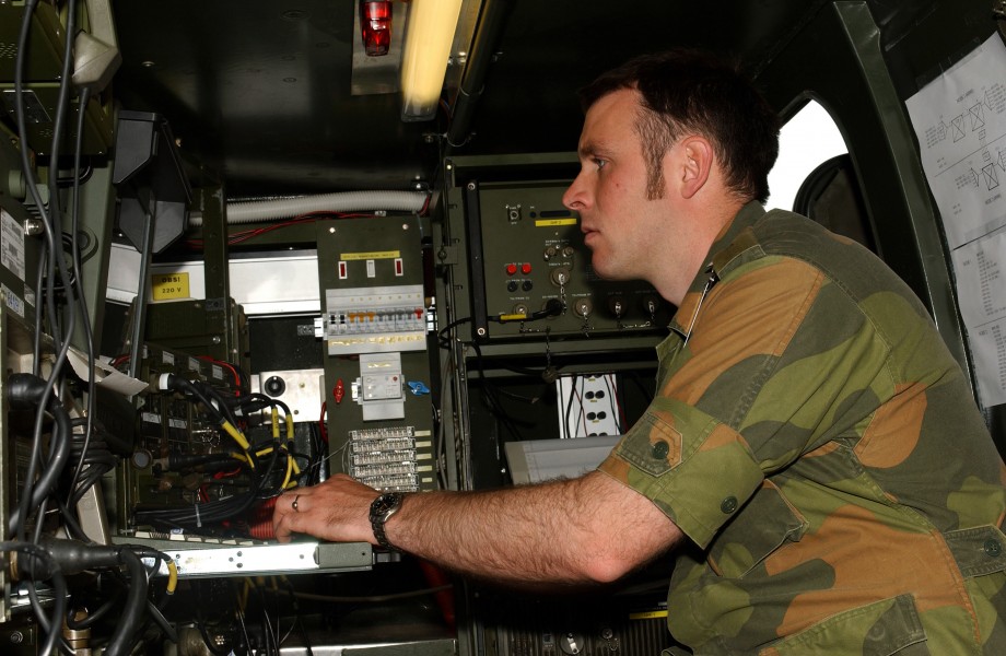 Norwegian signals captain seated w switching gear