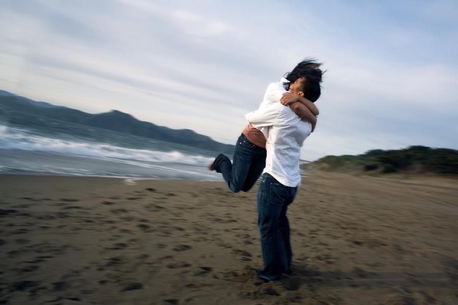 People hugging in the beach