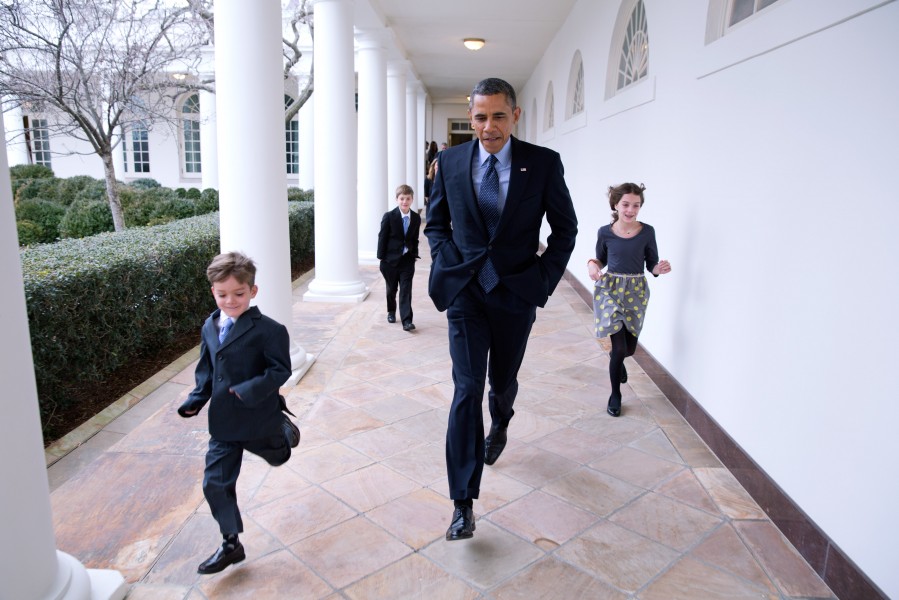 President Barack Obama runs along the Colonnade with Denis McDonough's children