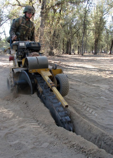 Seabee using trencher