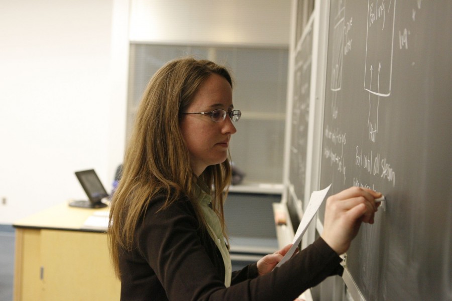 Teacher writing on a Blackboard