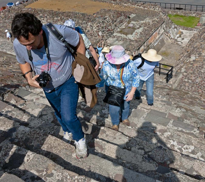 Tourists climbing lower stairs of Pyramid of the Sun at Teotihuacan