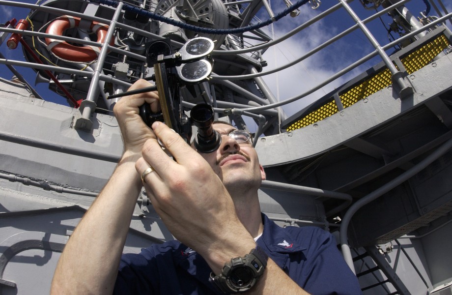 US Navy 030822-N-2613R-002 Aboard the destroyer USS Cushing (DD 985), Quartermaster 3rd Class Ryan Snyder, from Metropolis, Ind., shoots an azimuth bearing using a sextant
