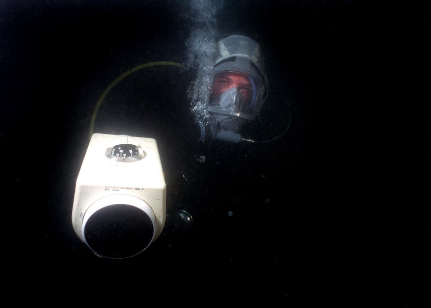 US Navy 040714-N-3093M-001 Lt. Evan Colbert assigned to the Explosive Ordnance Disposal Mobile Unit One One (EOD-11) uses a hand held sonar during a mine countermeasure training exercise