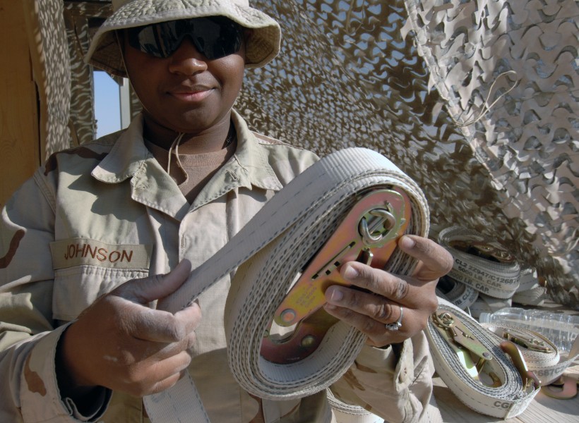 US Navy 071217-N-7027P-115 Seaman Juanita Johnson attached to Cargo Transfer Platoon (CTP) 3, rolls up 5,000lb cargo straps that are used to secure cargo