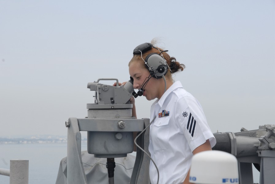 US Navy 080701-N-1928H-004 Quartermaster Seaman Amy Hover, assigned to the multi-purpose amphibious assault ship USS Bataan (LHD 5), takes bearings as the ship enters port in Boston