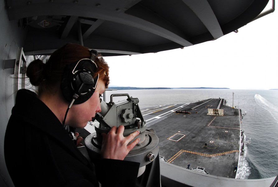 US Navy 080923-N-2610F-143 Quartermaster Seaman Shauna McDade uses an alidade navigation device to take bearing measurements