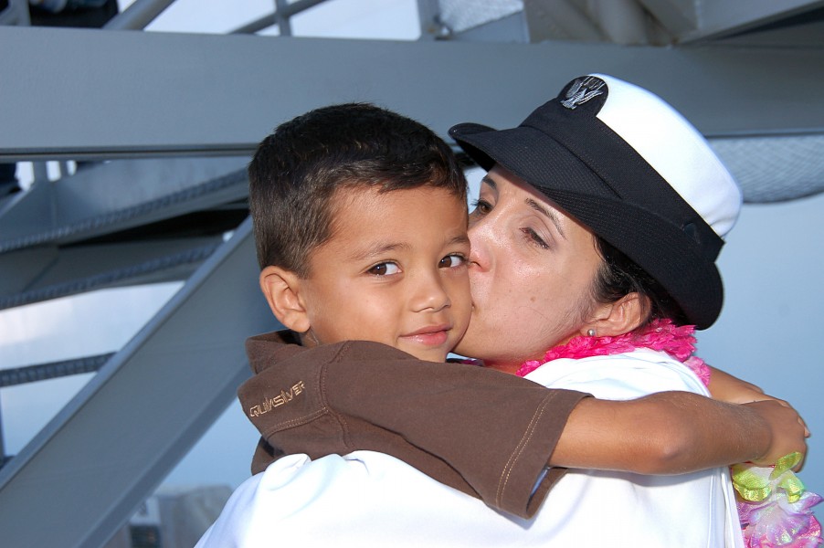 US Navy 080925-N-3570S-116 Hospital Corpsman 2nd Class Maria Collins-Alcala kisses her six-year old son