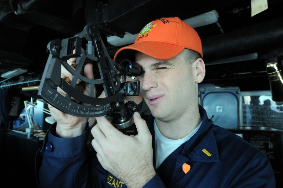 US Navy 081028-N-9774H-013 Ensign Timberon Vanzant determines the distance to another vessel through a stadimeter from the bridge of the amphibious assault ship USS Kearsarge (LHD 3)