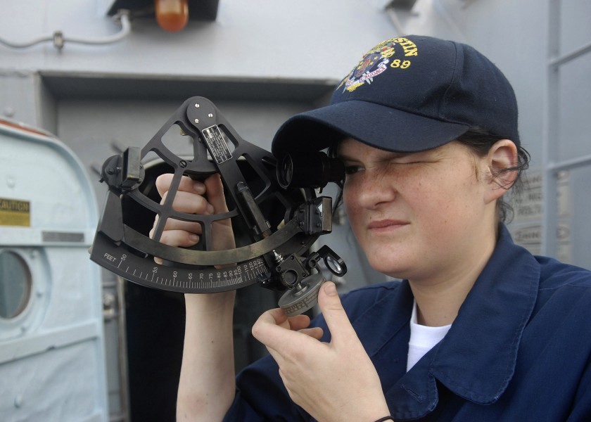 US Navy 091111-N-9520G-002 Quartermaster Seaman Samantha Elwell calculates the range distance as USS Mustin (DDG 89) approaches USNS Rappahannock (T-AO 204)