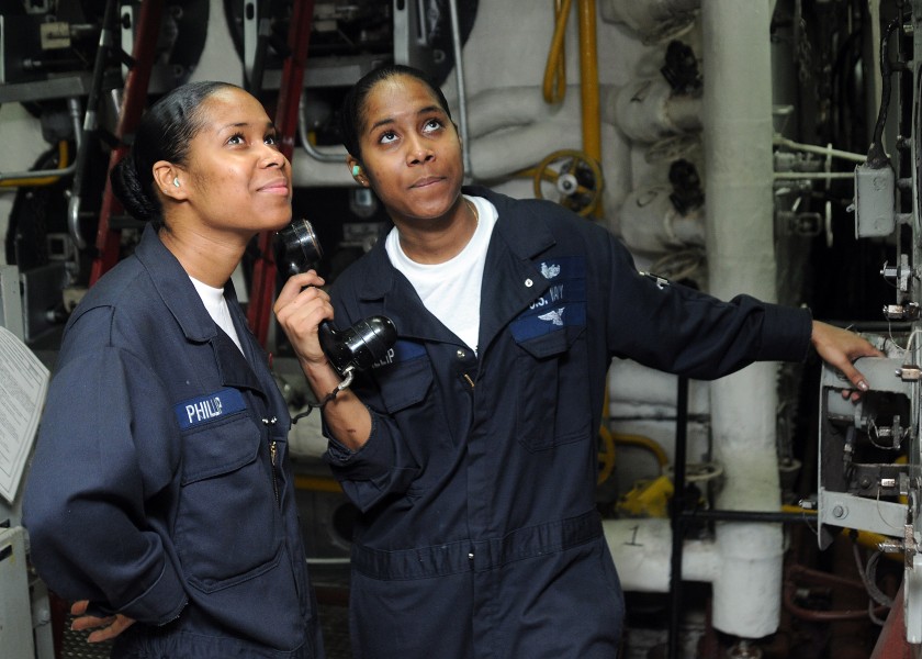 US Navy 100629-N-5215E-029 Machinist's Mate Firemen Sonia Philip, left, and Sophia Philip report the status of the ship's ^2 boiler during the Board of Inspection and Survey 
