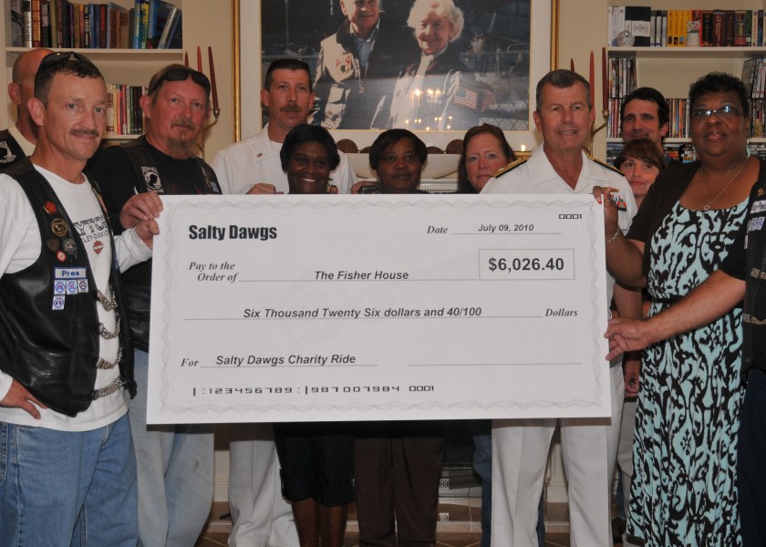 US Navy 100709-N-8361C-001 Rear Adm. Alton Stocks accepts a check for $6,026.42 on behalf of The Fisher House