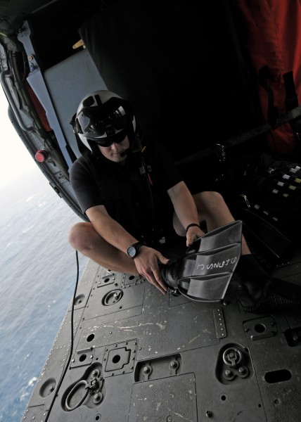 US Navy 101014-N-5016P-167 Naval Air Crewman 2nd Class Wesley Evans, assigned to Helicopter Sea Combat Squadron (HSC) 12, dons his rescue swimmer g