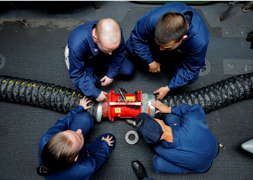 US Navy 101026-N-2908M-006 Sailors aboard the amphibious assault ship USS Kearsage (LHD 3) conduct damage control training on a ventilation fan dur