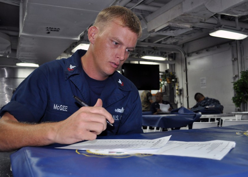 US Navy 101109-N-3620B-022 Boatswain's Mate 2nd Class Kerry McGee takes a medical level-of-knowledge examination aboard the amphibious transport do
