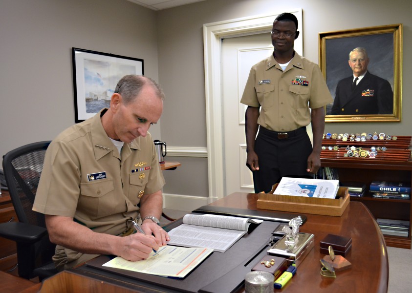 US Navy 111031-N-FC670-004 Chief of Naval Operations (CNO) Adm. Jonathan Greenert reads the Combined Federal Campaign (CFC) pamphlet