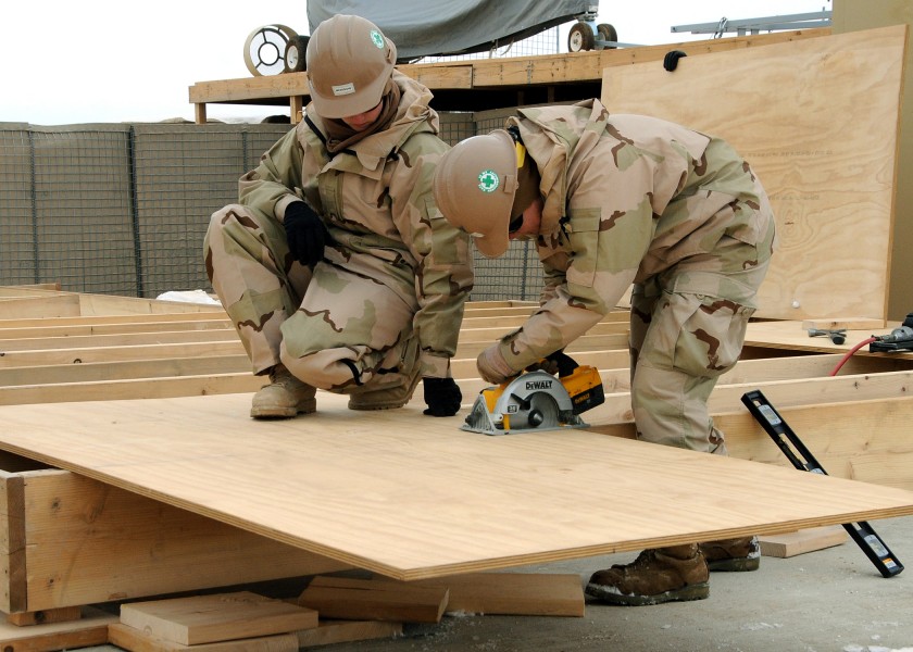 US Navy 120202-N-SD610-003 A Sailor operates a circular saw during the construction of a wood deck for an Alaska tent