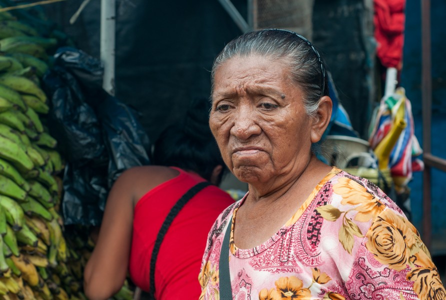 Wayuu woman with sad face in the market buying