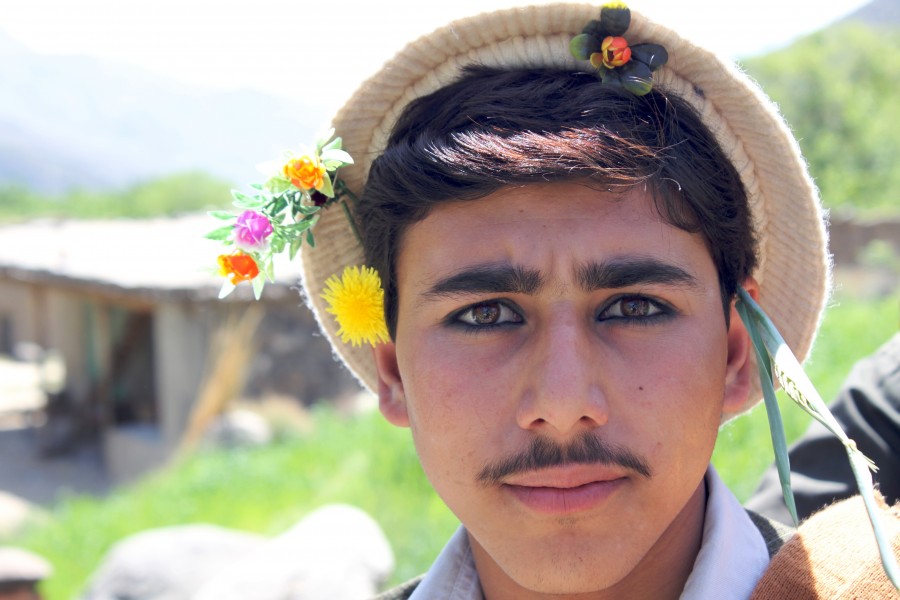 Young Pashai man with flowers in his hair