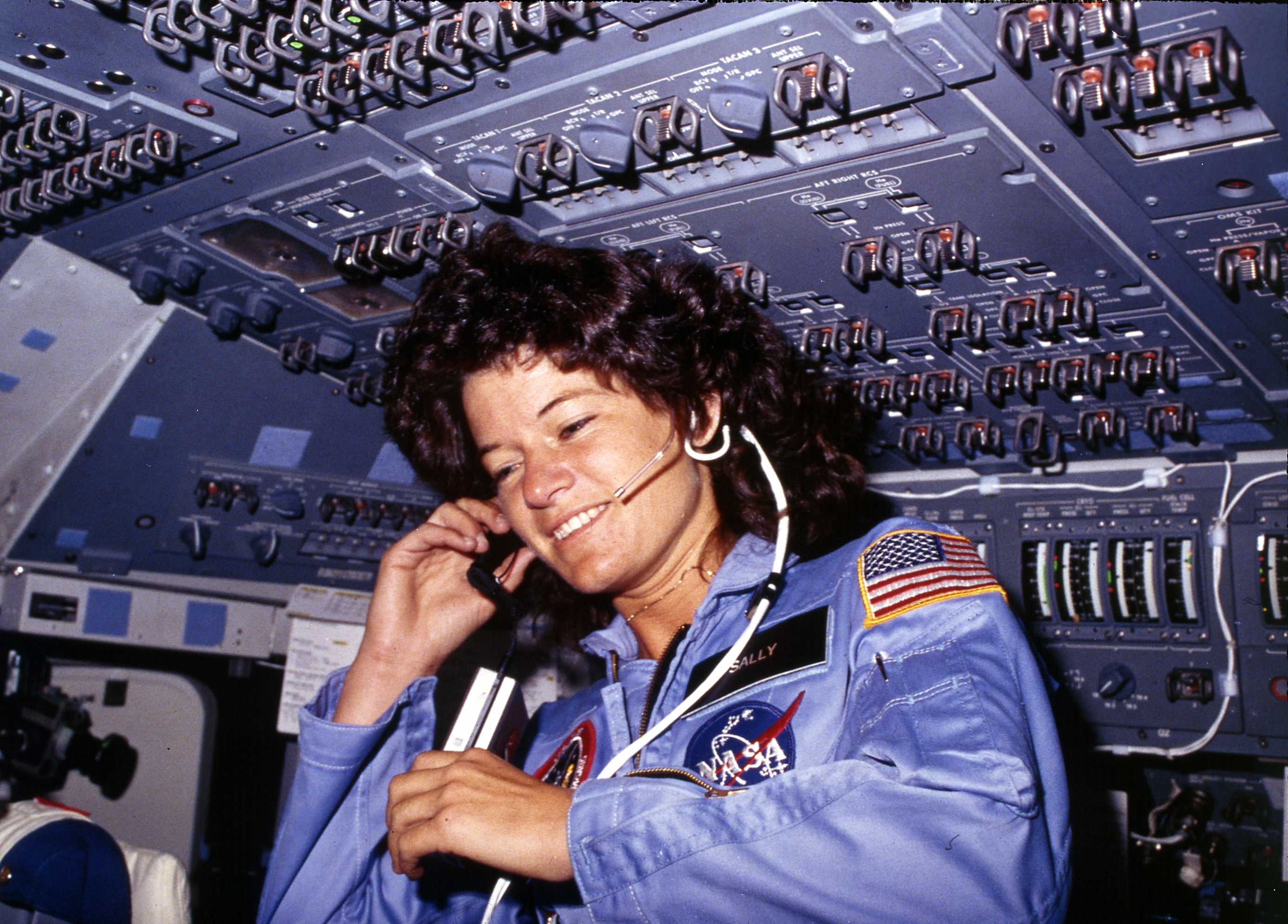 Sally Ride, America's first woman astronaut communitcates with ground controllers from the flight deck - NARA - 541940