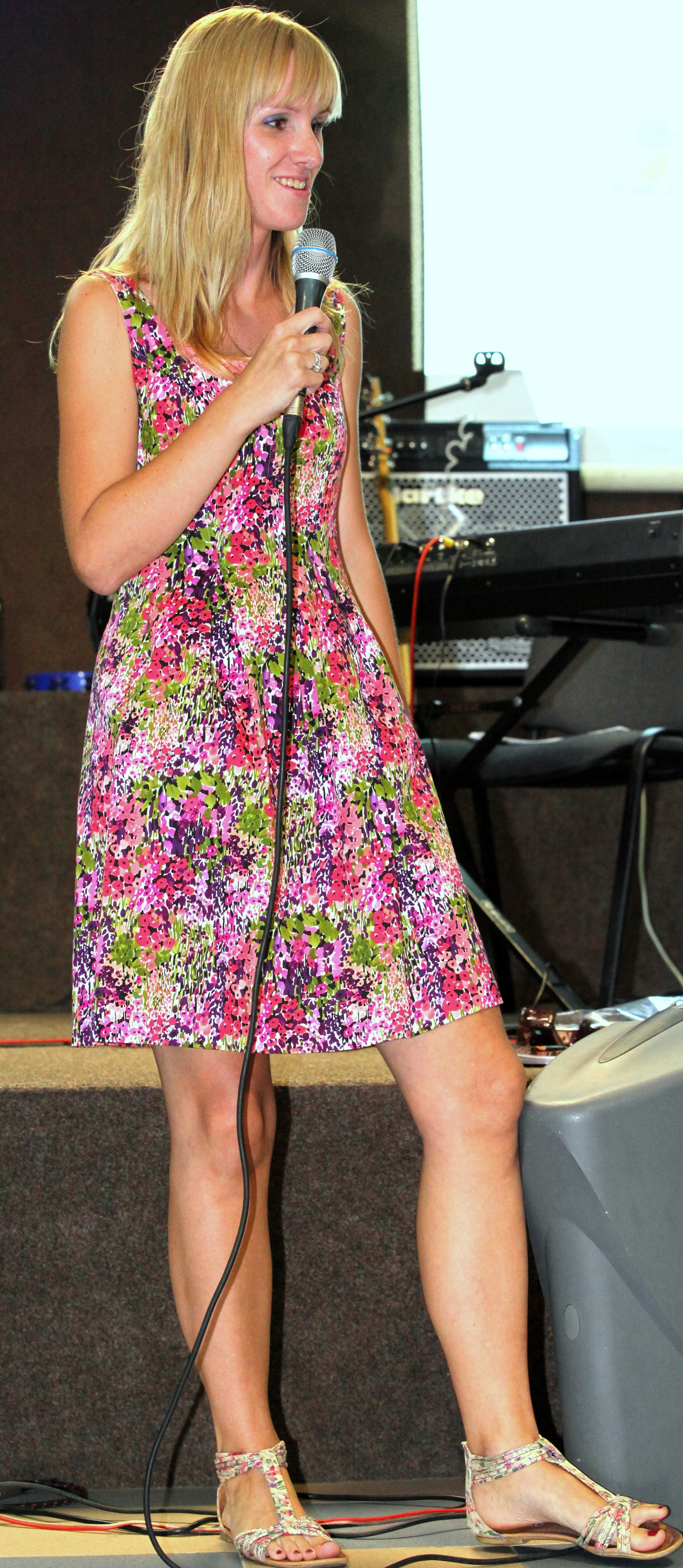 a blond girl in a colorful dress at a protestant gathering in July 2013, image 7/7