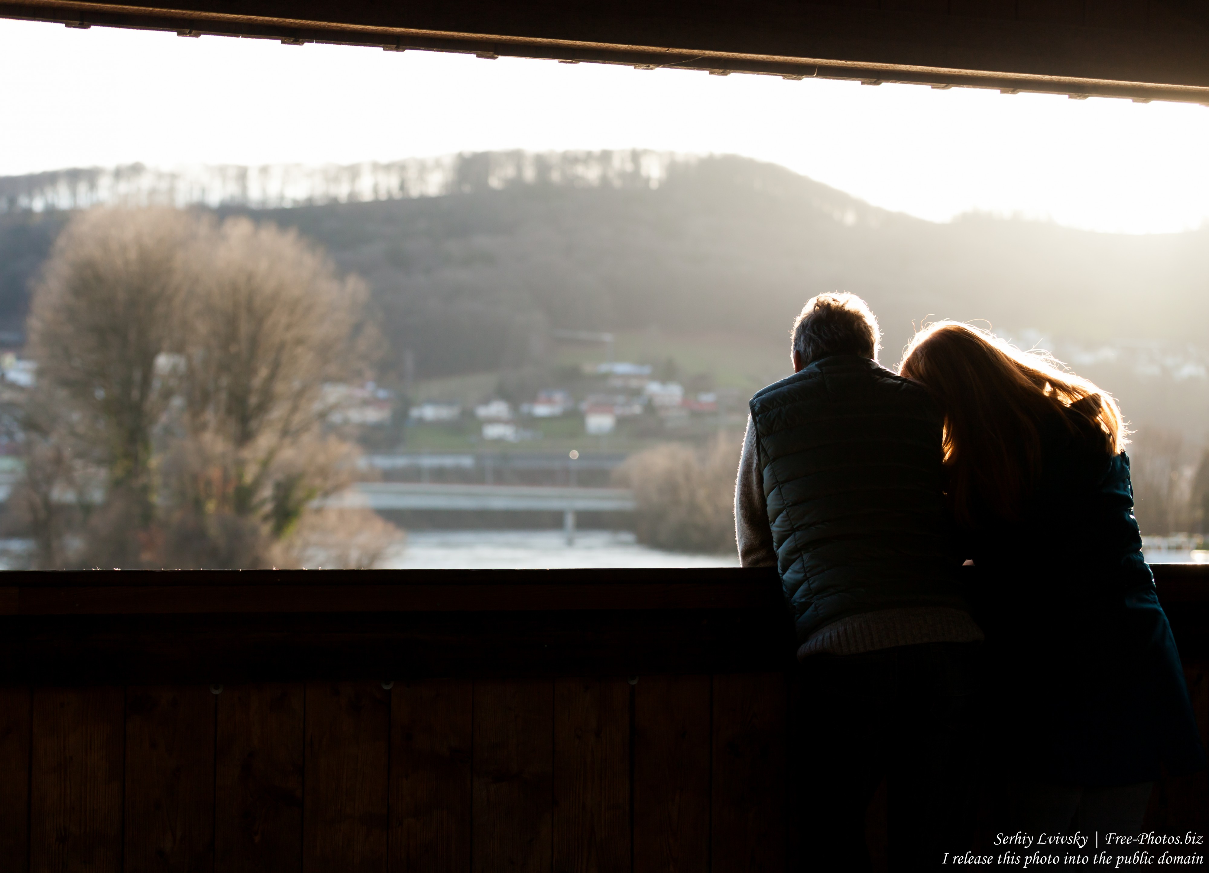a couple at a bridge over Rhine connecting Germany and Switzerland, photographed in December 2017 by Serhiy Lvivsky