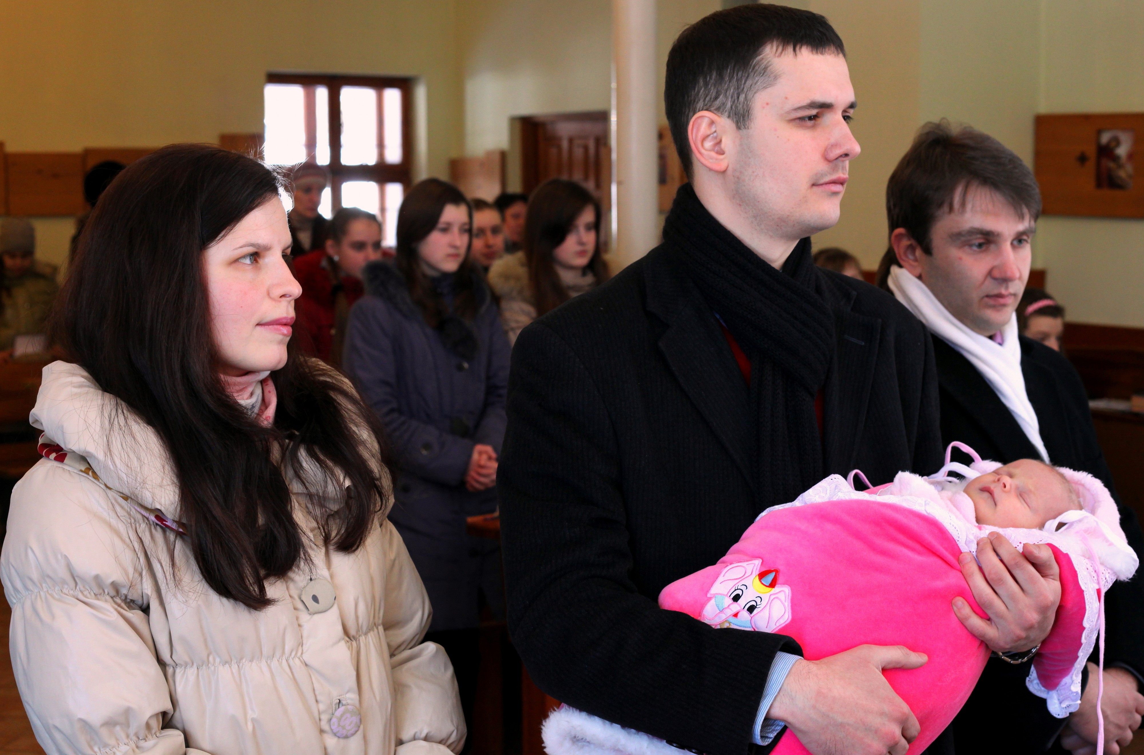 baptism of a baby girl in a Catholic church, picture 4