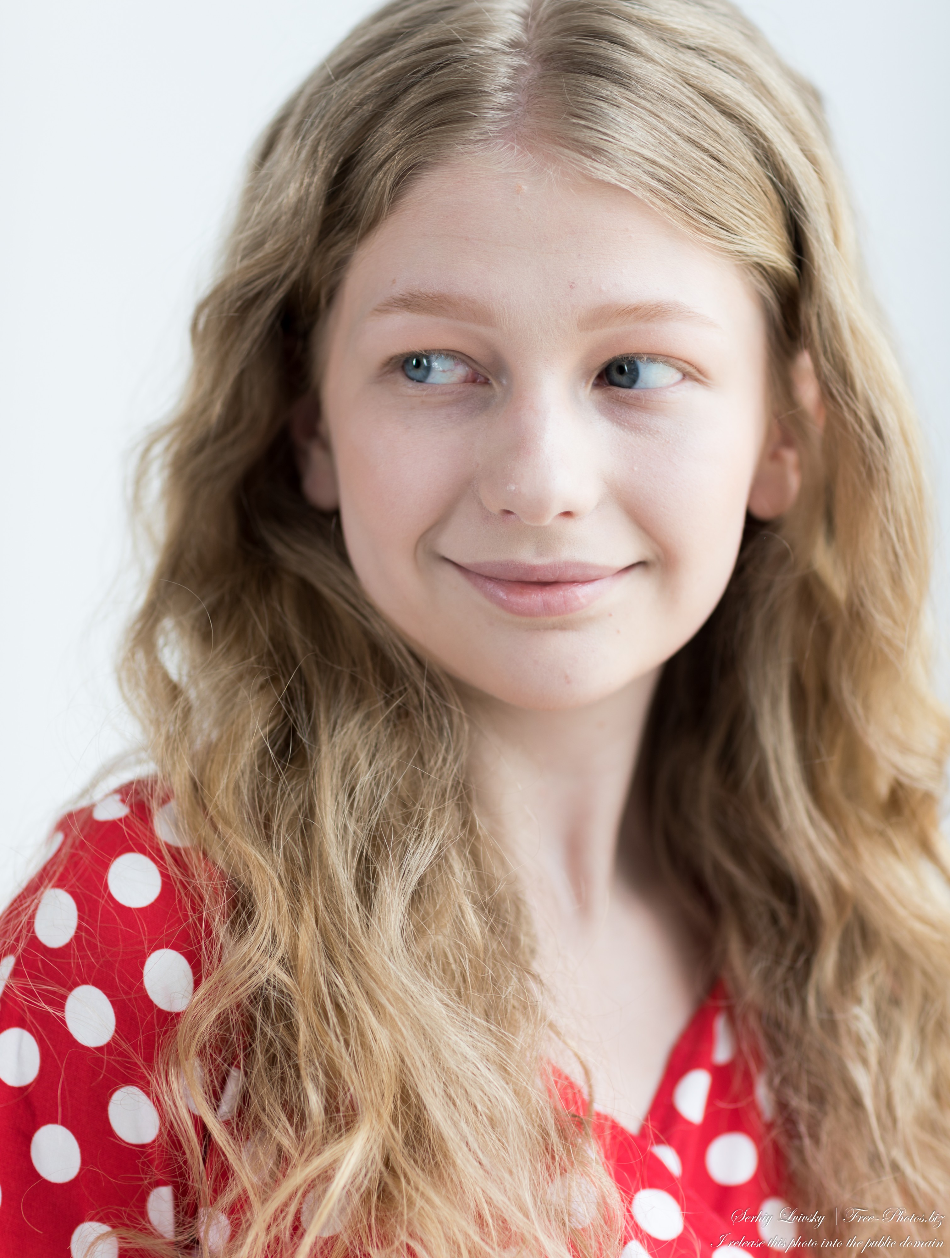 Nastia - an 18-year-old natural curly blonde girl with grey-blue eyes, photographed in June 2024 by Serhiy Lvivsky, portrait 3/14