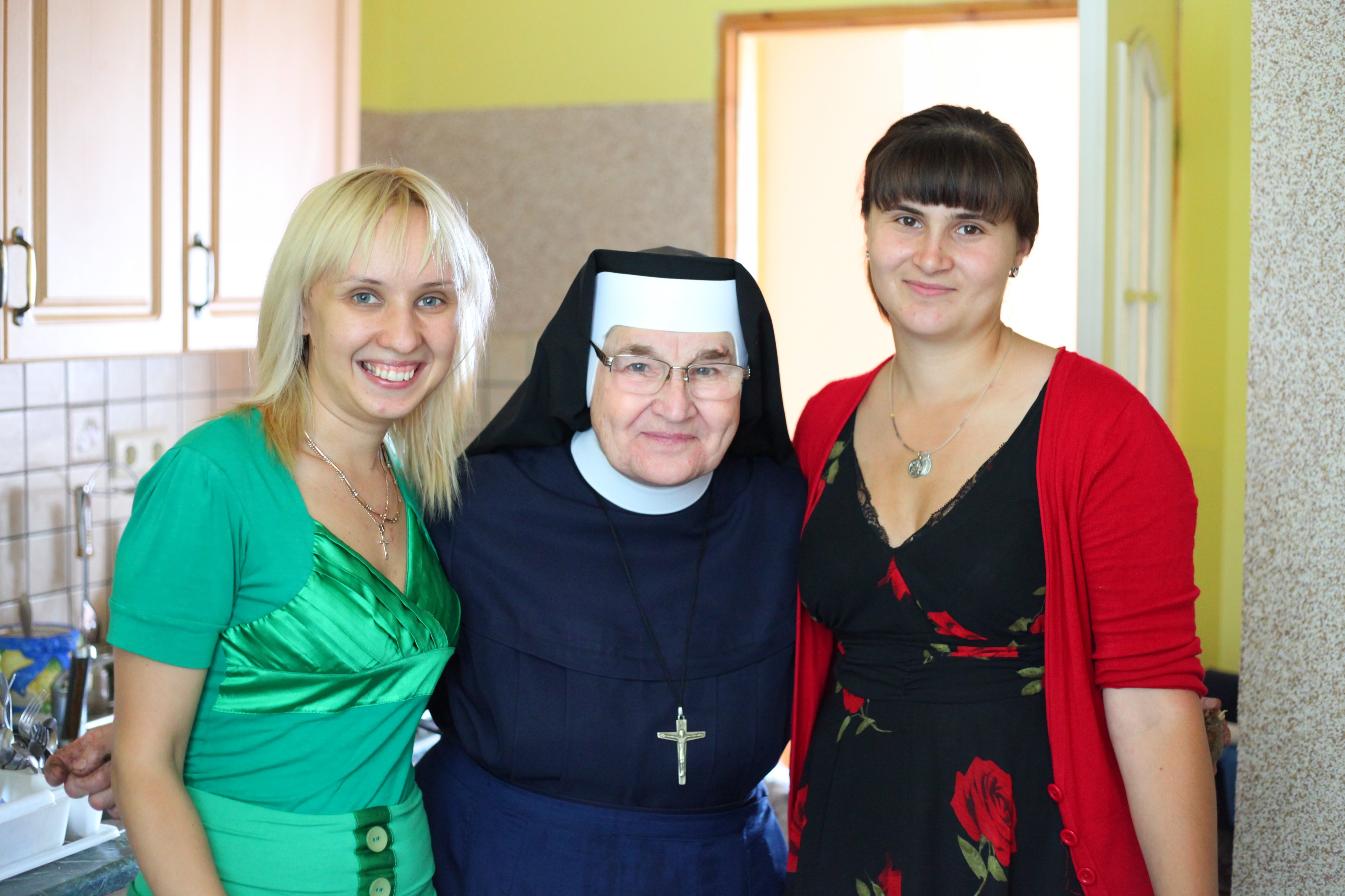 A nun with two young Catholic women