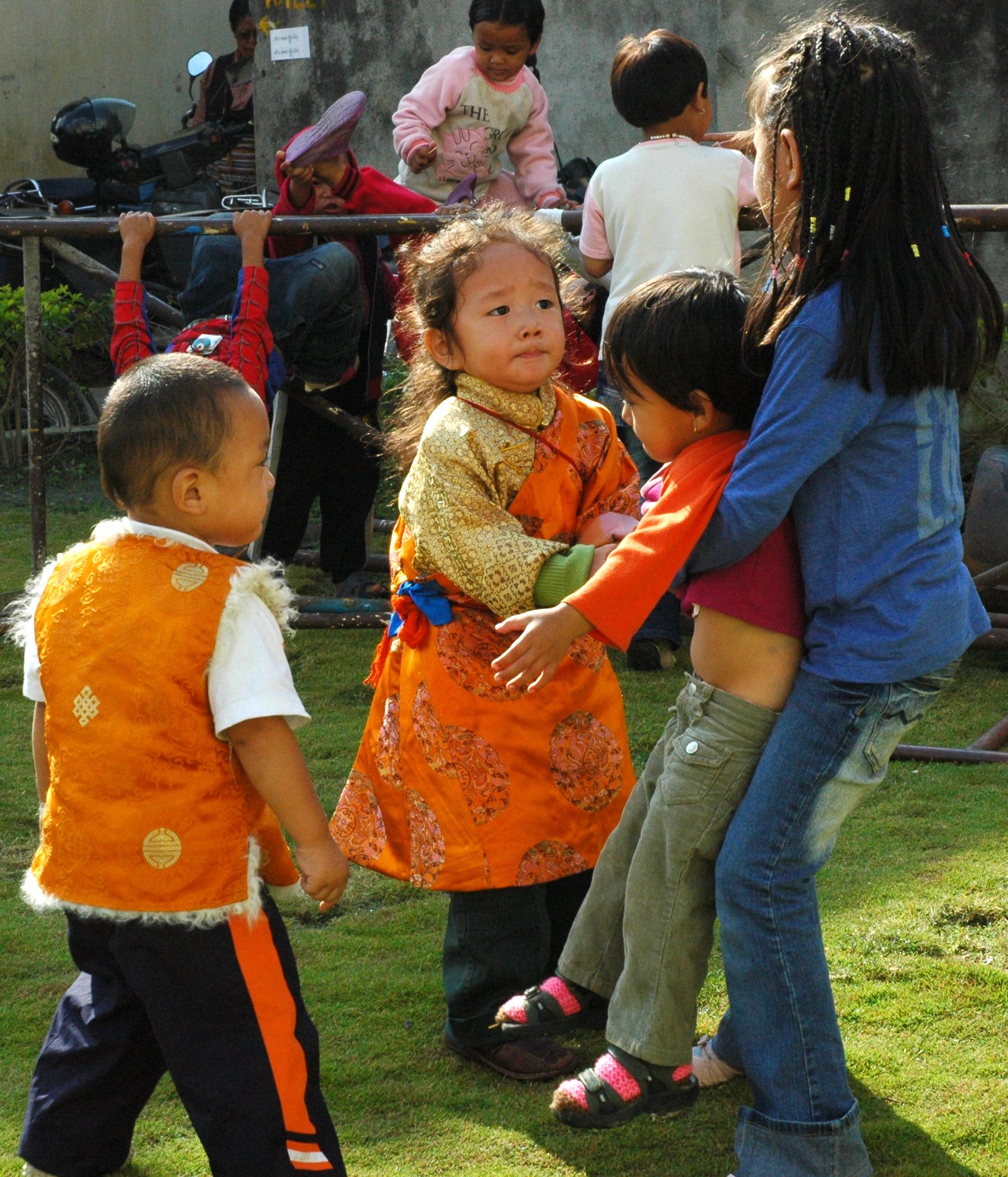 Tibetan boy in orange chuba