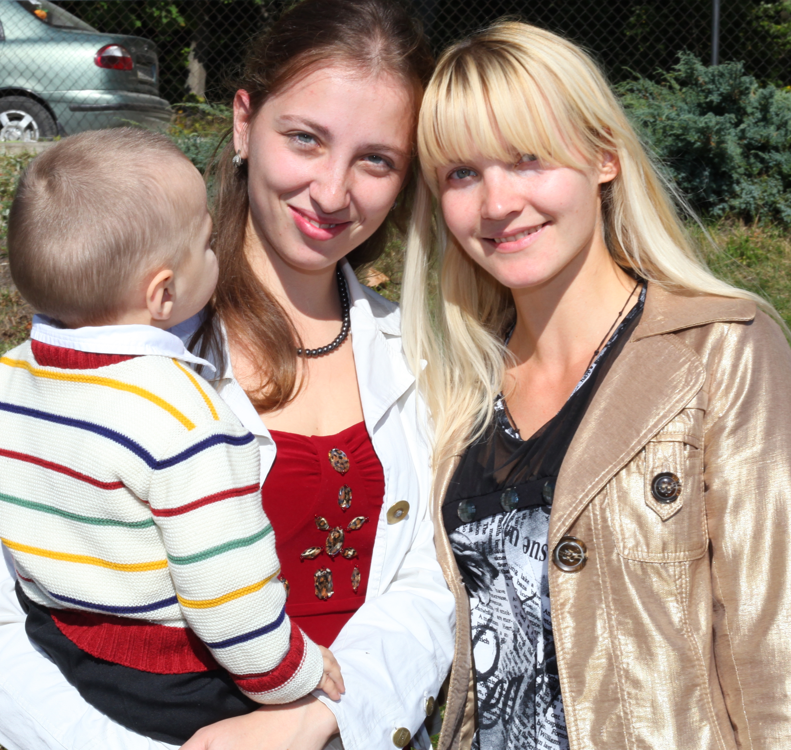 two beautiful young charming Catholic women and a baby boy, photo 5