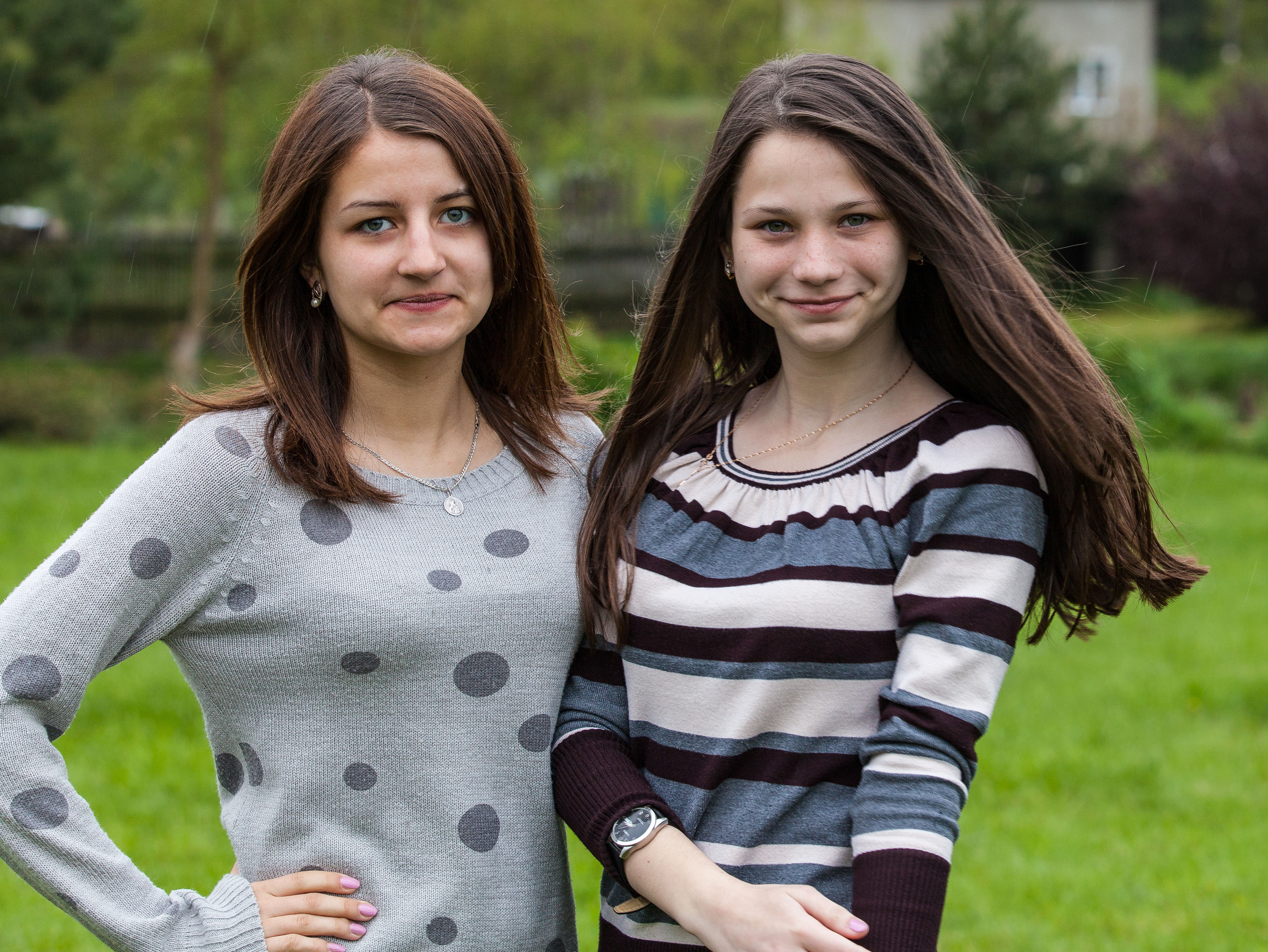 two charming brunette girls photographed in a Catholic recollection and recreation center in May 2014, picture 6/6