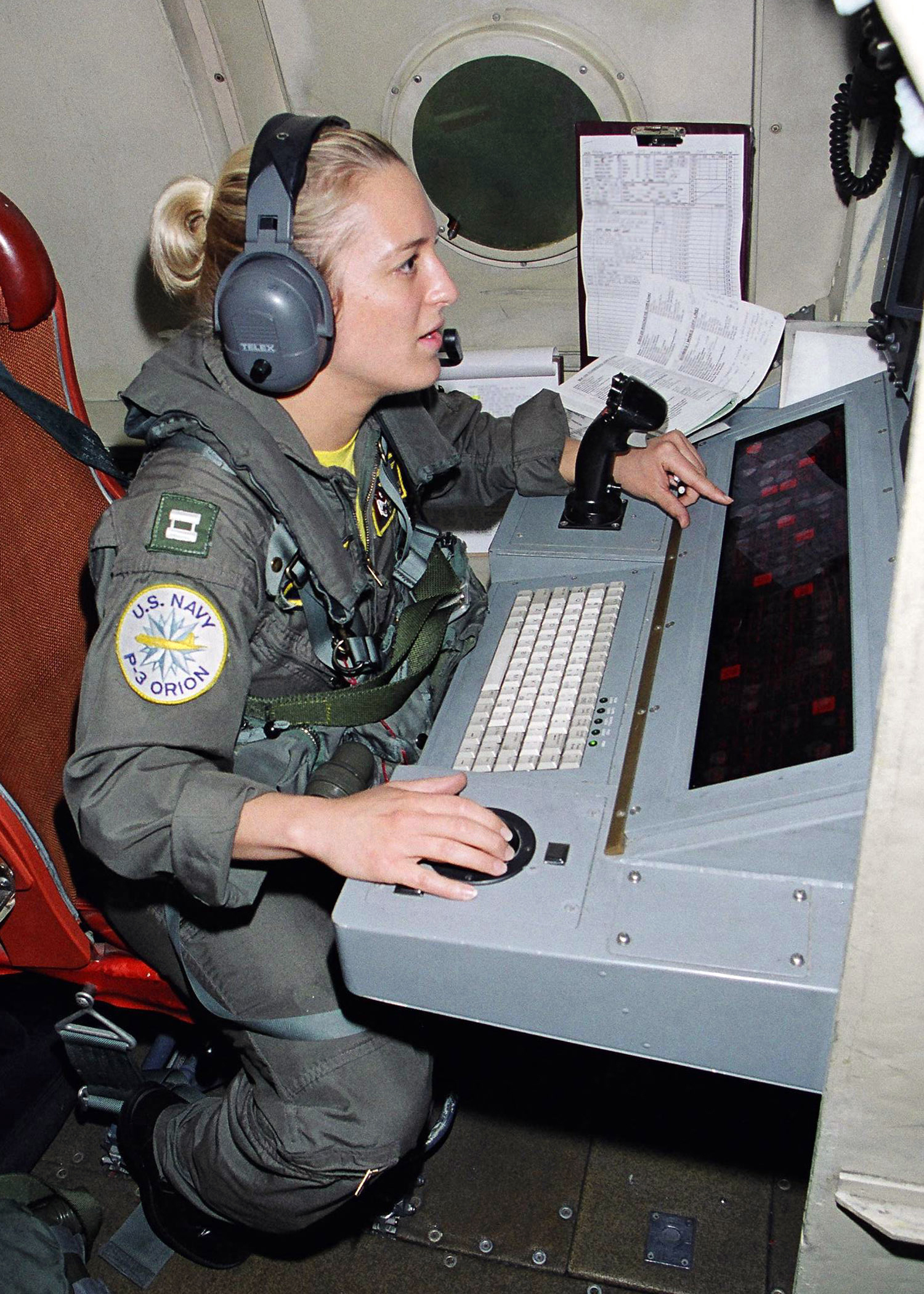 US Navy 030508-N-0020T-005 Lt. Kososki operates the tactical coordinator (TACCO) station 