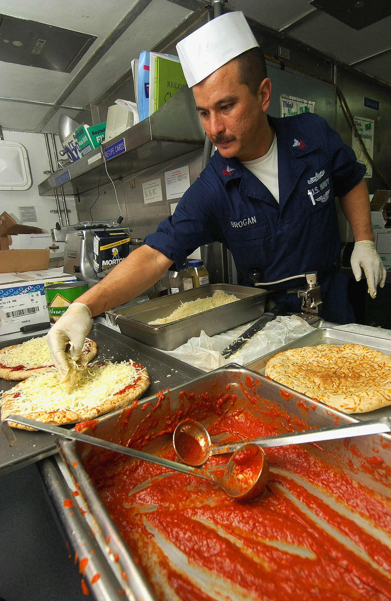 US Navy 030913-N-5471P-002 petty officers make pizzas for the crew for 