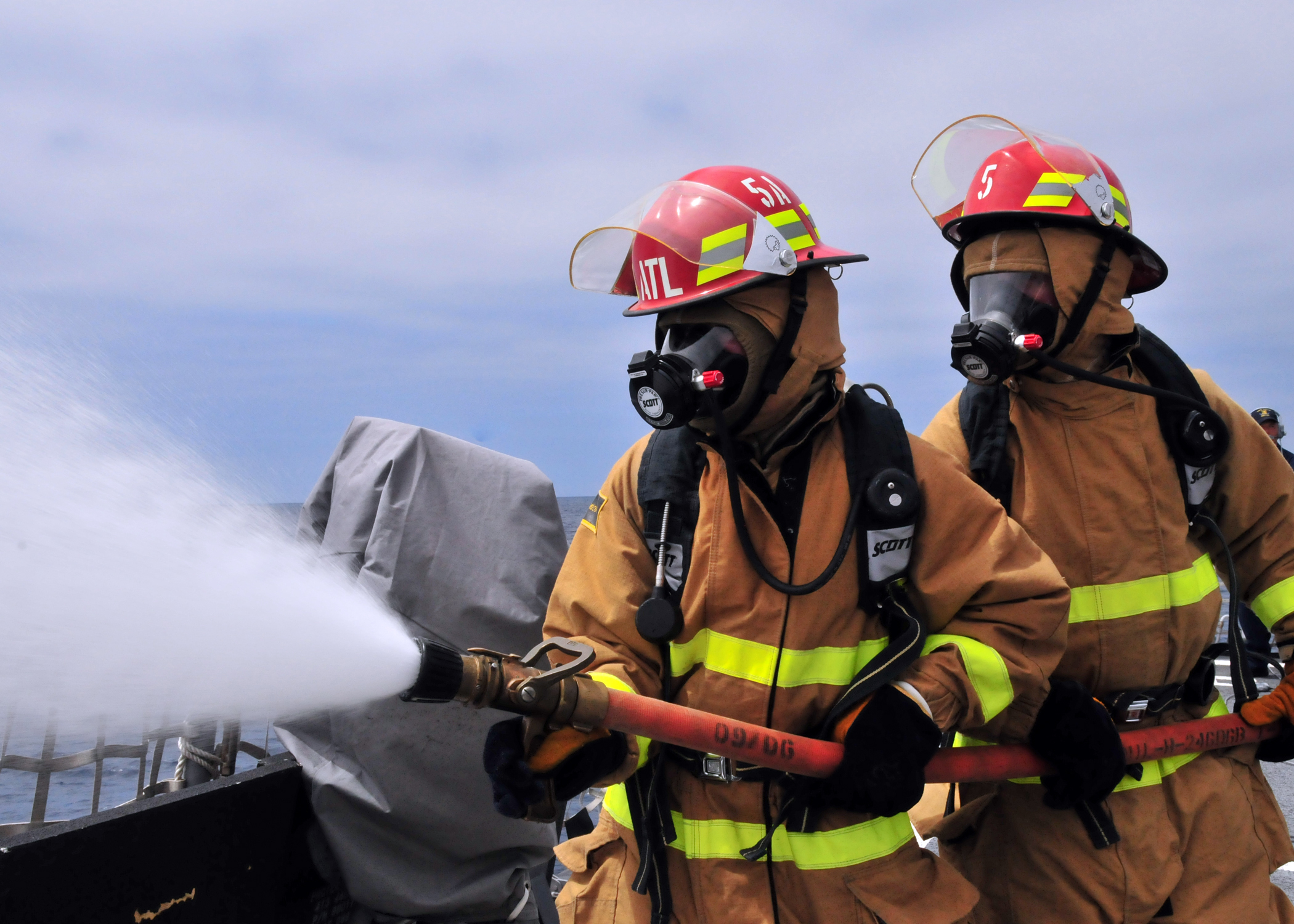 US Navy 080729-N-1488S-021 Midshipmen learn how to operate as members of a hose team aboard the guided-missile destroyer USS Kidd (DDG 100)