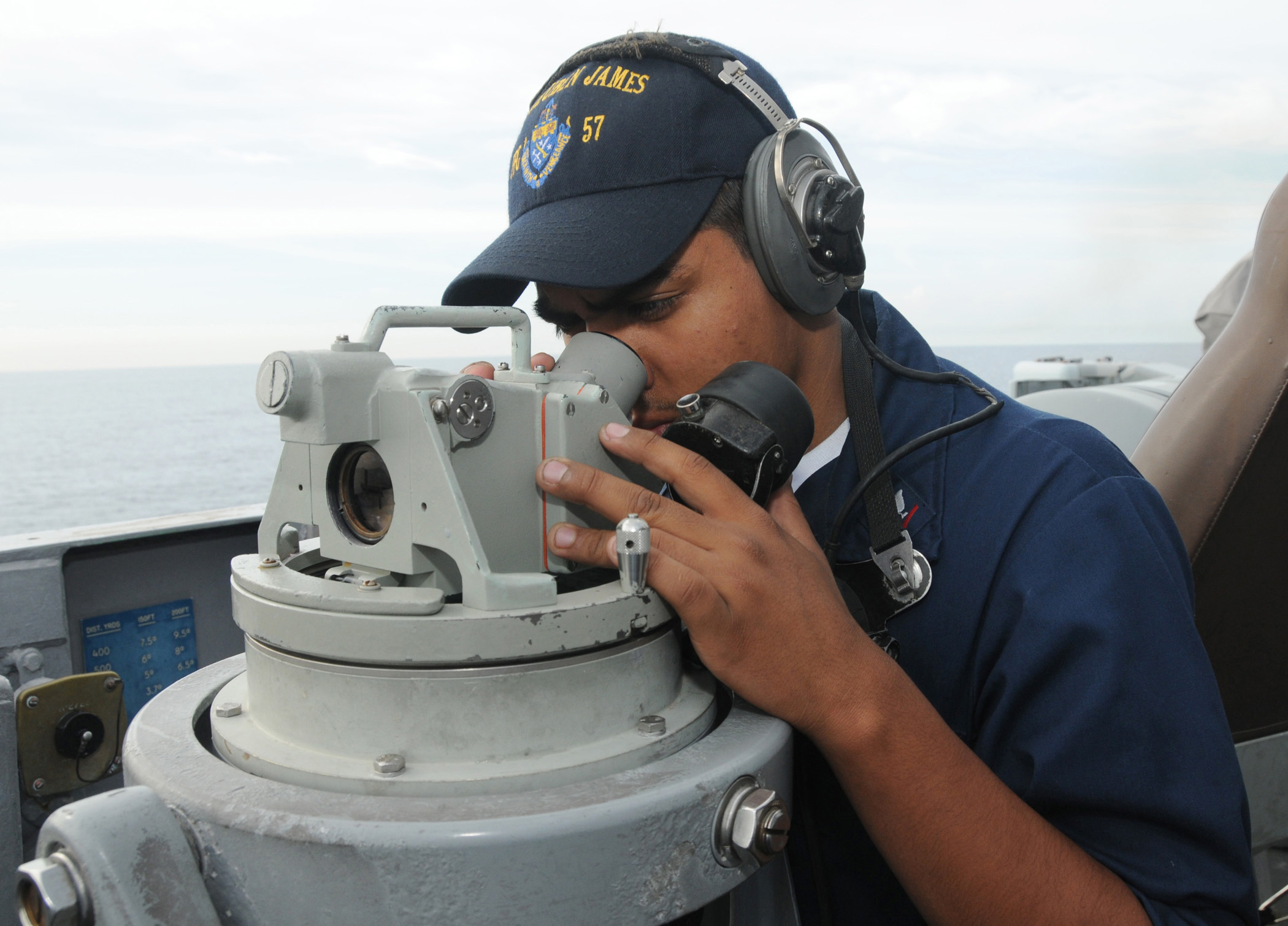 US Navy 090417-N-3666S-015 Operations Specialist 3rd Class Jesse Salgado looks through a Polaris on the bridge of the guided-missile frigate USS Reuben James (FFG 57)