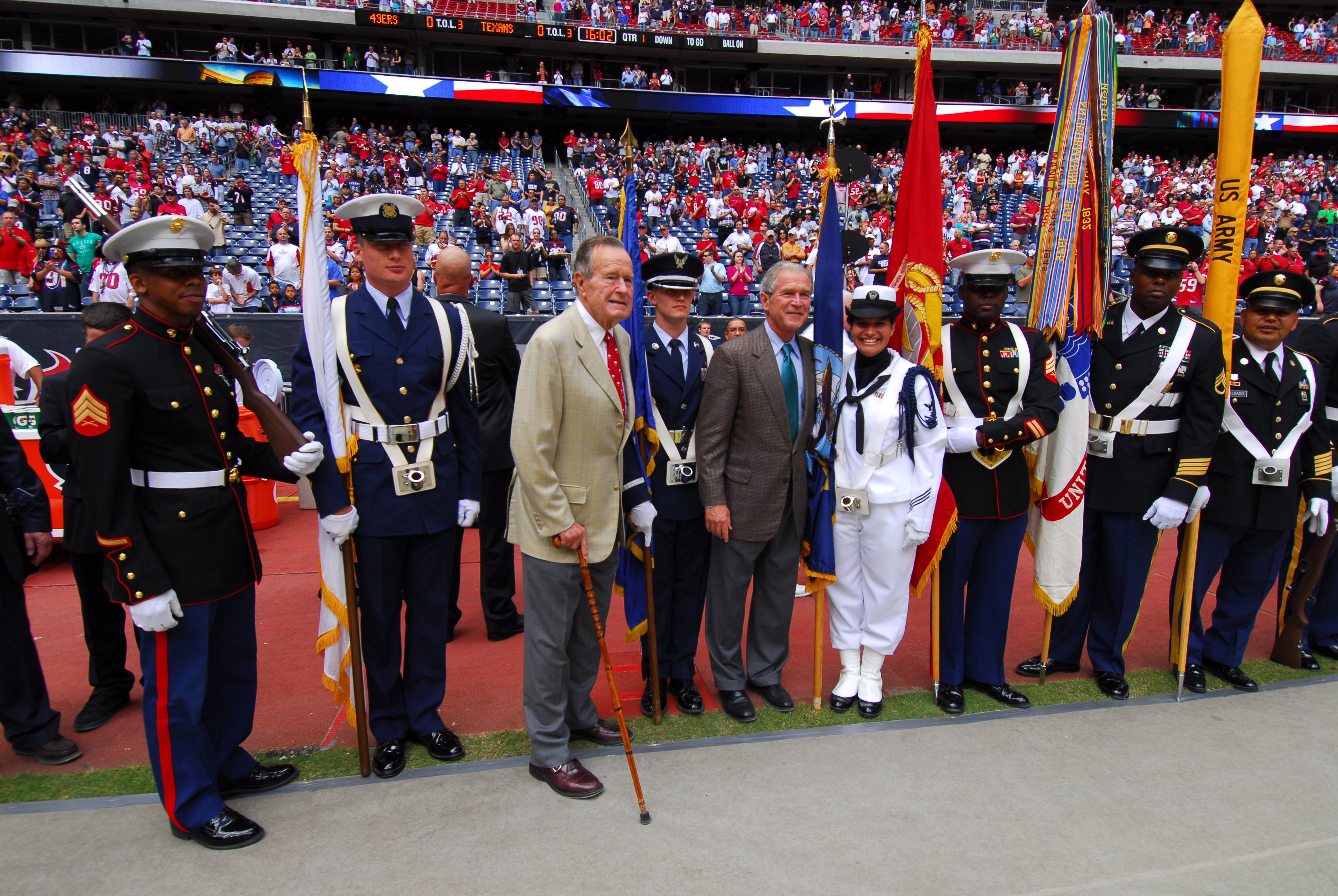 US Navy 091025-N-1854W-185 Former U.S. Presidents George H.W. Bush, center-left, and George W. Bush pose with a Joint Services Color Guard during Navy Week celebrations in Houston